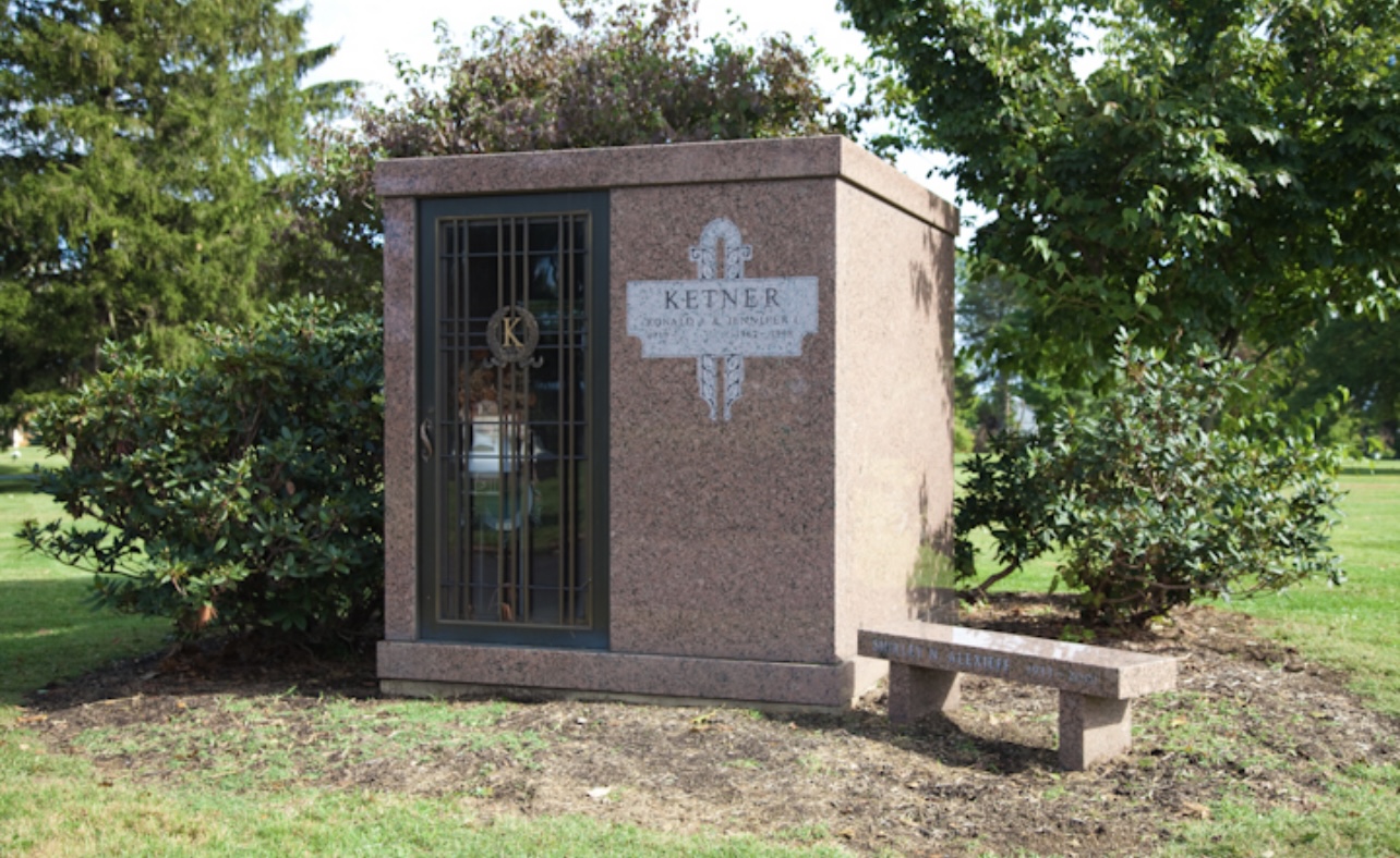 Family estate cemetery section with multiple burial plots and central monument